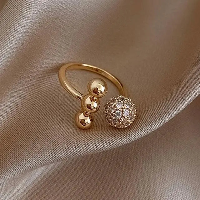 Triple Ball Ring made of Gold and Zirconium Dioxide Unique Joyas