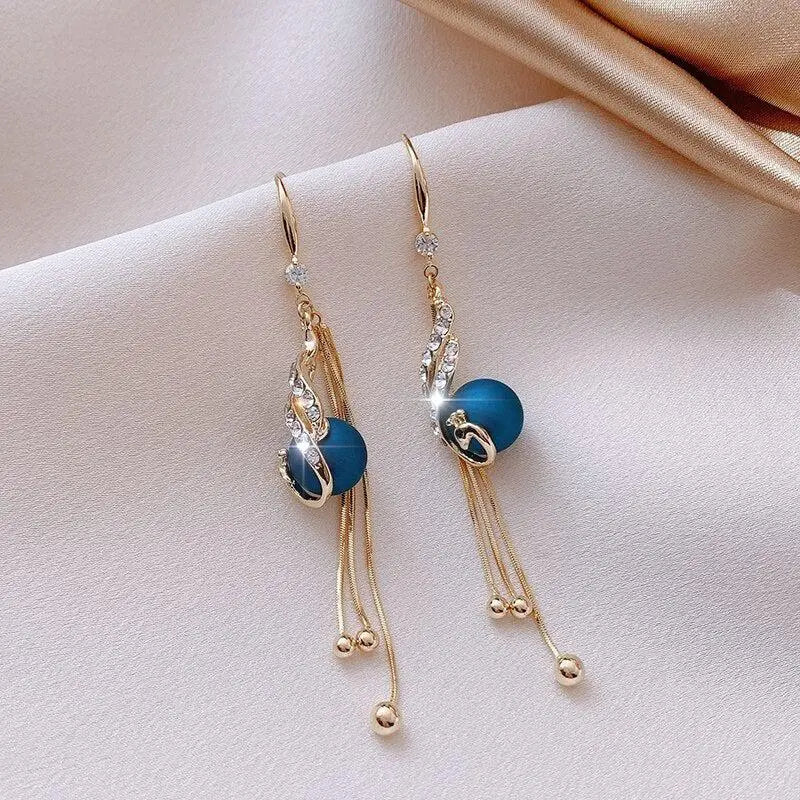 Festive Earrings with Blue Pearls