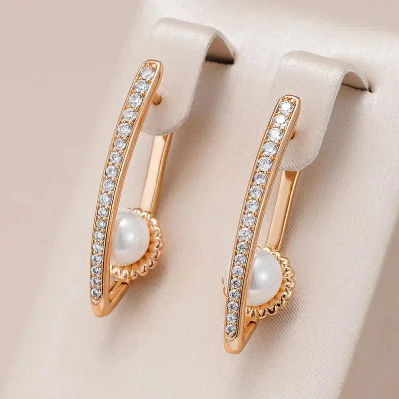 Elegant pointed earrings with pearl and zirconia in gold Unique Joyas