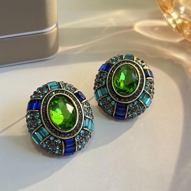 Vintage earrings with green crystal and blue zirconia