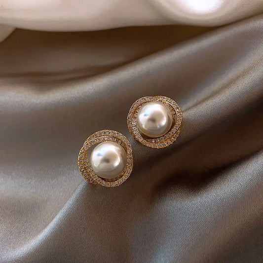 Elegant pearl earrings adorned with diamonds