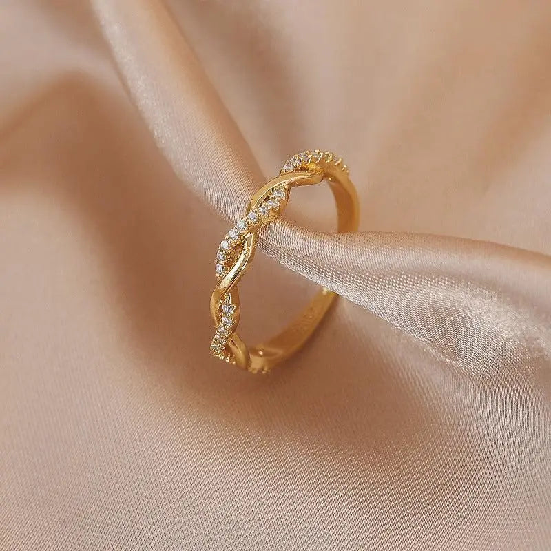 Adjustable ring with gold braided zirconia stones Unique Joyas