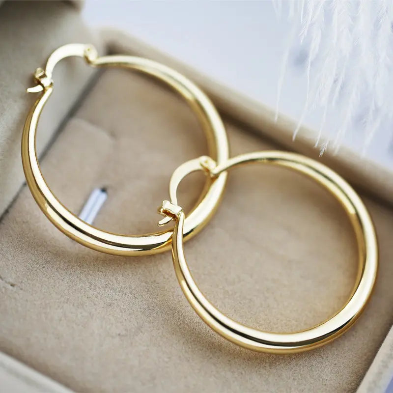 Golden hoop earrings Unique Joyas