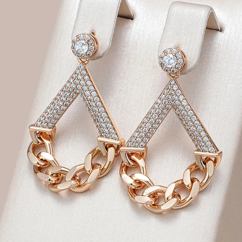 Elegant earrings with gold-shimmering chains Unique Joyas