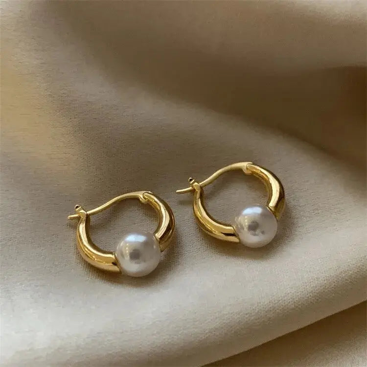 Elegant golden pearl earrings