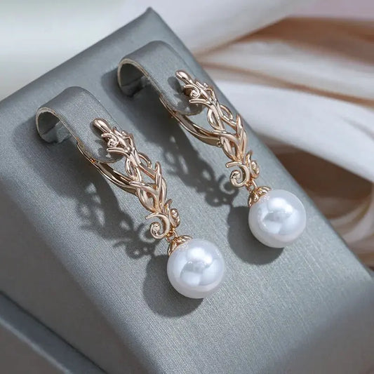 Elegant dangling pearl earrings Unique Joyas