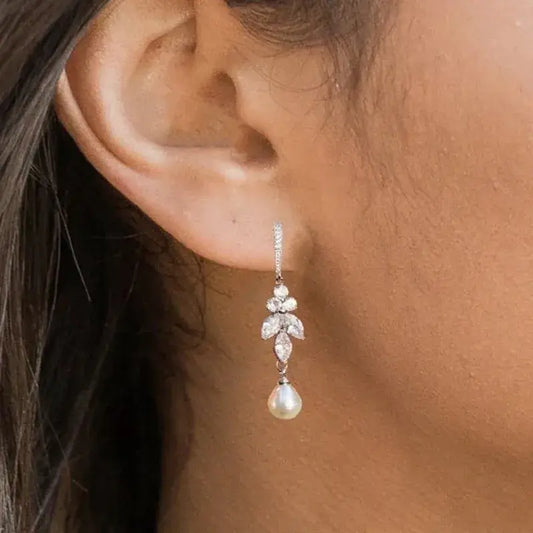 Earrings with dangling pearls in zirconia leaves Unique Joyas