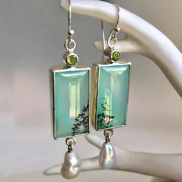 Pearl earrings with green enamel