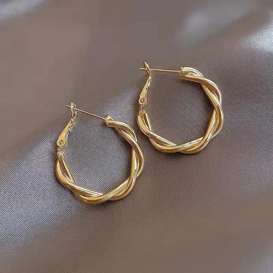 Elegant golden knotted earrings Unique Joyas