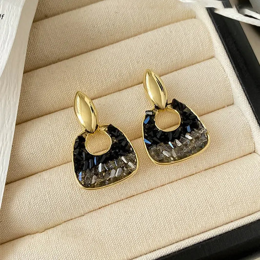 Elegant earrings in black crystal and gold Unique Joyas