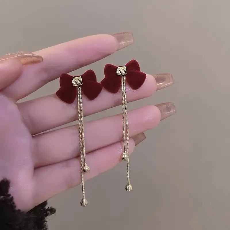 Elegant dangling red bow earrings Unique Joyas