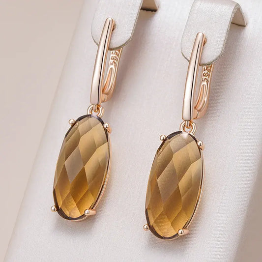 Elegant earrings in brown oval crystal. Unique Joyas