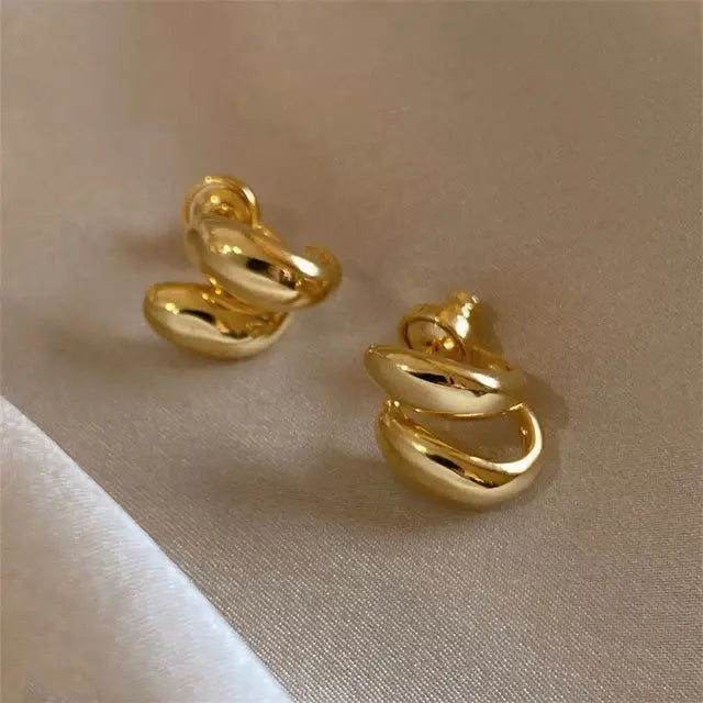 Elegant gold spiral earrings Unique Joyas