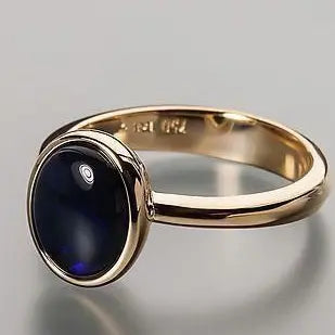 Golden ring made of dark glass Unique Joyas